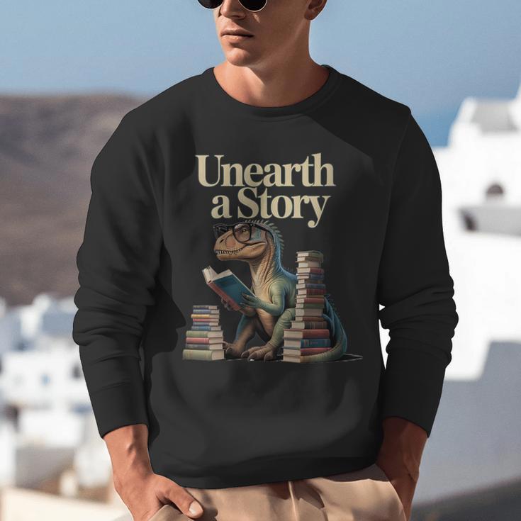 Women's Unearth A Story Dinosaur Reading a Library Book Unisex Sweatshirt