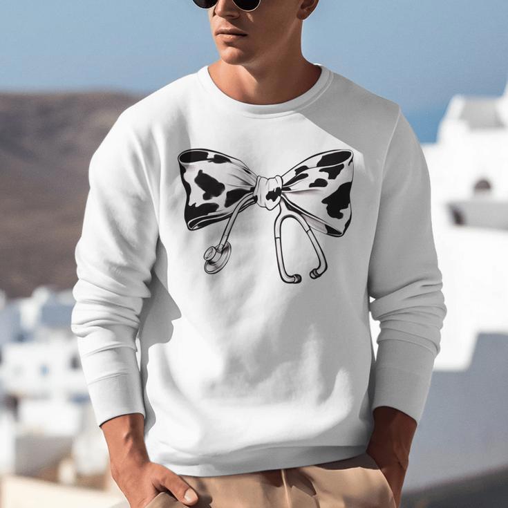 Cow Print Bow And Stethoscope Nurse RN Graduation Coquette Unisex Sweatshirt