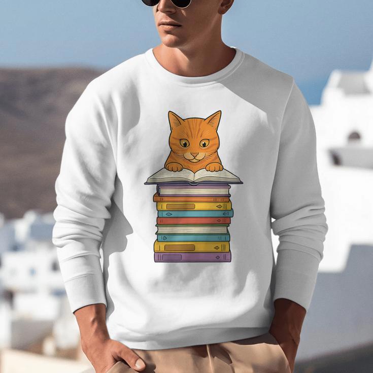 Cute Orange Tabby Cat Reading On Pile Of Books Unisex Sweatshirt Cute Orange Tabby Cat Reading On Pile Of Books Unisex Sweatshirt
