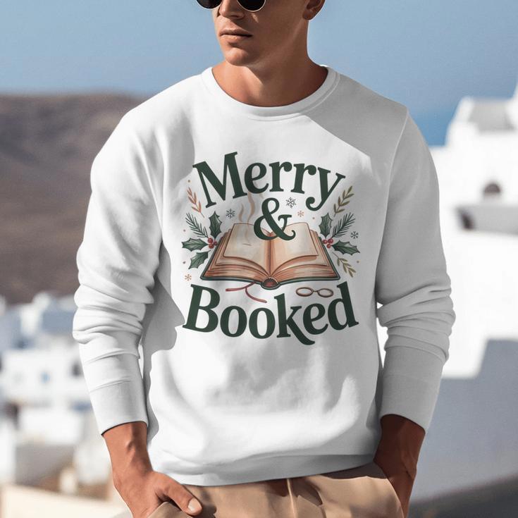 Merry And Booked Holiday Reading Winter Book Lover Premium Tri-Blend Unisex Sweatshirt