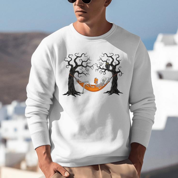 Skeleton Reading Book In Hammock Halloween Reader Unisex Sweatshirt