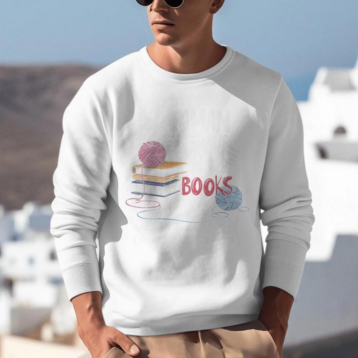 A Woman Cannot Survive On Books Alone She Also Needs Yarn Premium Unisex Sweatshirt