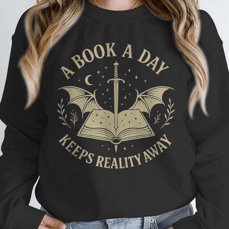 A Book A Day Keeps Reality Away Reading Escape Quote Unisex Sweatshirt