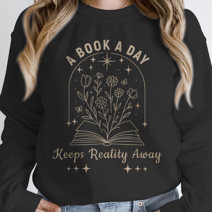 A Book A Day Keeps Reality Away Unisex Sweatshirt