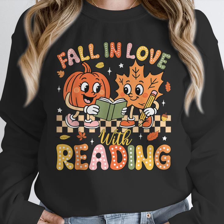 Fall In Love With Reading Autumn Pumpkin Teacher Book Lover Unisex Sweatshirt
