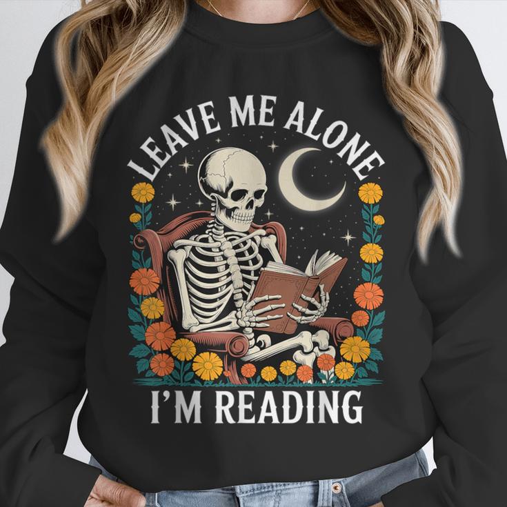 Leave Me Alone Skeleton Reading Book Floral Moon Librarian Unisex Sweatshirt