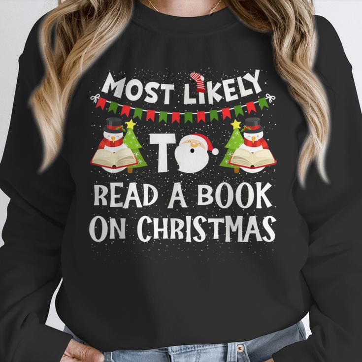 Most Likely To Read A Book On Christmas Snowman Family Unisex Sweatshirt
