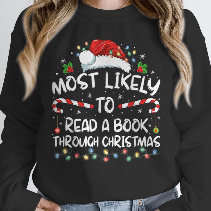 Most Likely To Read A Book Through Christmas Xmas Unisex Sweatshirt Most Likely To Read A Book Through Christmas Xmas Unisex Sweatshirt