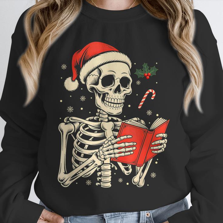 Skeleton Reading Book Christmas Teacher Librarian Book Lover Unisex Sweatshirt