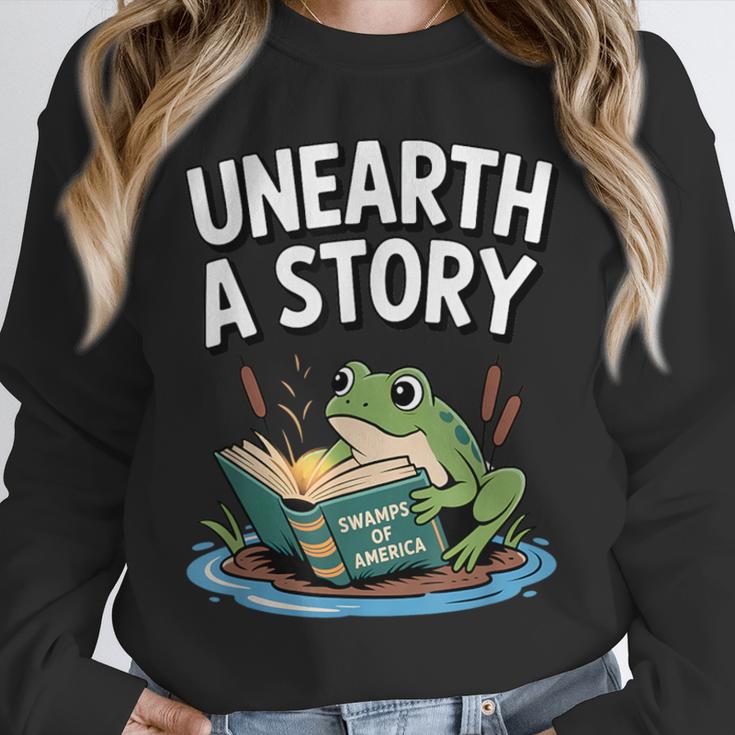 Unearth a Story Frog Reading a Book Summer 2026 Unisex Sweatshirt