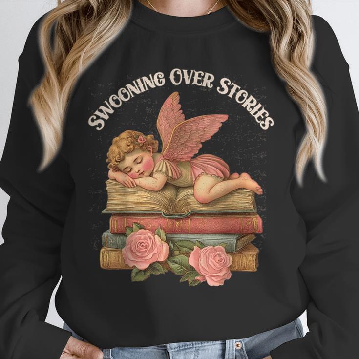Valentine's Swooning Over Stories Cupid And Book Lover Tee Unisex Sweatshirt