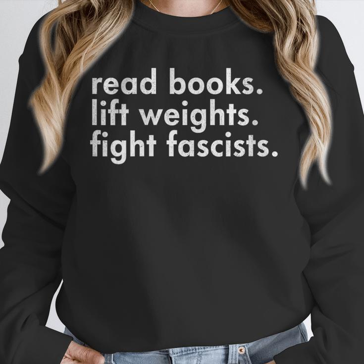 Women's Read Books Lift Weights Fight Fascists Reading Activism Meme Unisex Sweatshirt Women's Read Books Lift Weights Fight Fascists Reading Activism Meme Unisex Sweatshirt