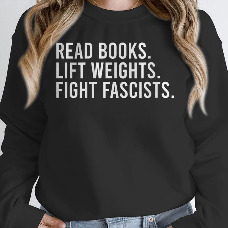 Women's Read Books Lift Weights Fight Fascists Reading Activism Unisex Sweatshirt Women's Read Books Lift Weights Fight Fascists Reading Activism Unisex Sweatshirt