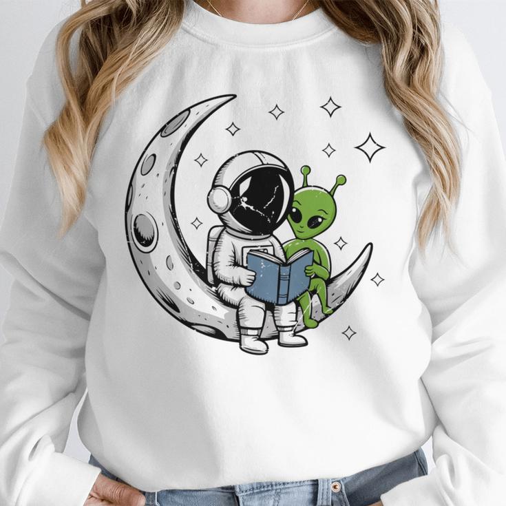 Astronaut Reading Book To Alien Moon Space Astronomy Unisex Sweatshirt