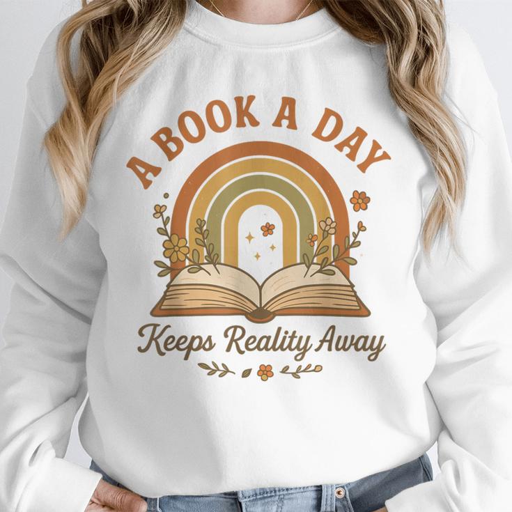 A Book A Day Keeps Reality Away Reading Unisex Sweatshirt A Book A Day Keeps Reality Away Reading Unisex Sweatshirt