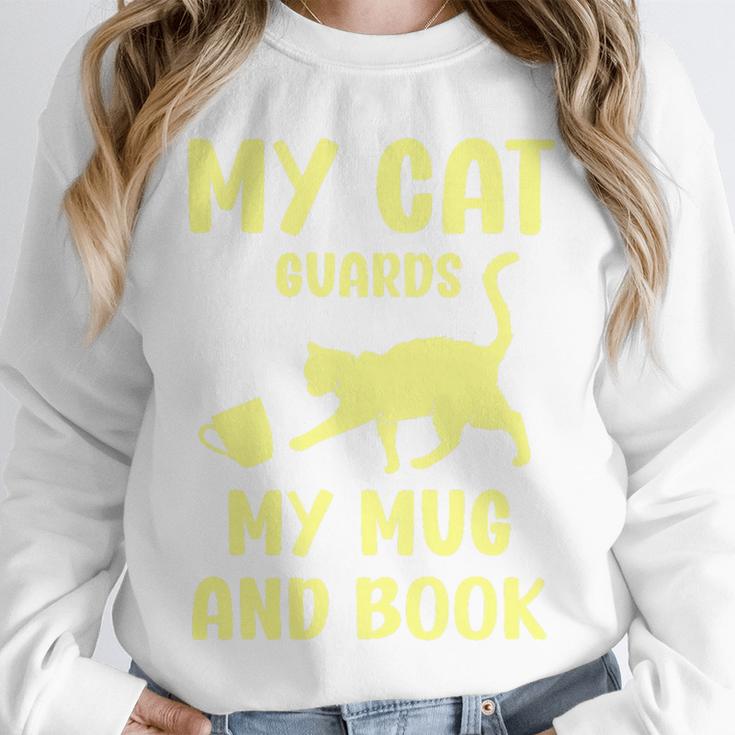 My Cat Guards My Mug And Book Humor Cats Premium Tri-Blend Unisex Sweatshirt
