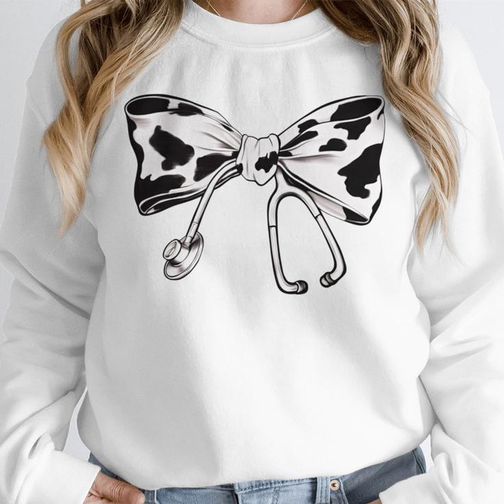 Cow Print Bow And Stethoscope Nurse RN Graduation Coquette Unisex Sweatshirt