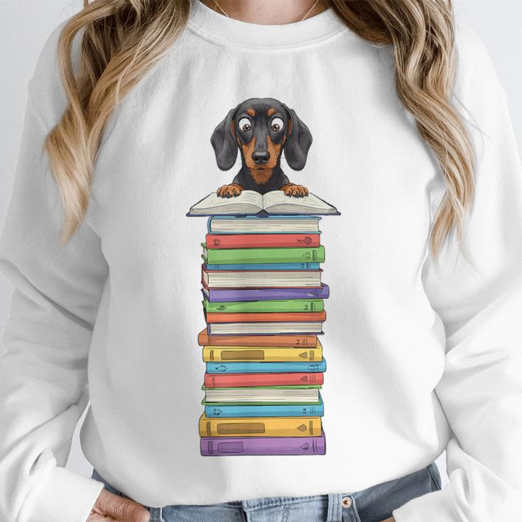 Cute Wiener Dog Dachshund Reading On Pile Of Books Unisex Sweatshirt Cute Wiener Dog Dachshund Reading On Pile Of Books Unisex Sweatshirt