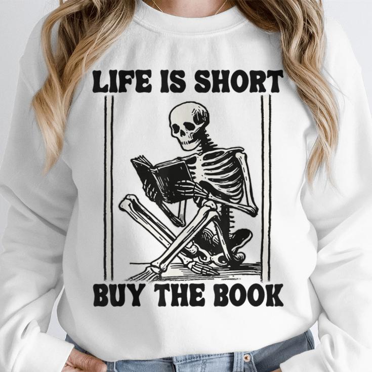 Life Is Short Buy The Book Skeleton Book Lover Reading Unisex Sweatshirt Life Is Short Buy The Book Skeleton Book Lover Reading Unisex Sweatshirt