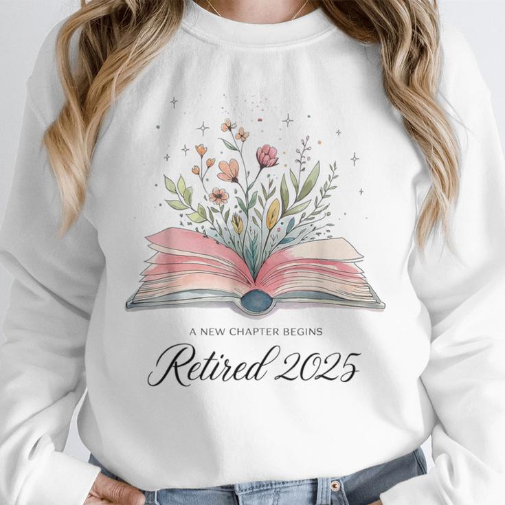 Quote New Chapter Begins Retired 2025 Floral Open Book Unisex Sweatshirt Quote New Chapter Begins Retired 2025 Floral Open Book Unisex Sweatshirt