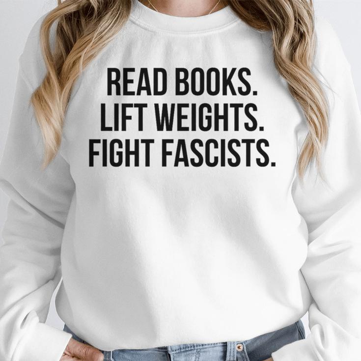 Read Books Lift Weights Fight Fascists Premium Tri-Blend Unisex Sweatshirt Read Books Lift Weights Fight Fascists Premium Tri-Blend Unisex Sweatshirt