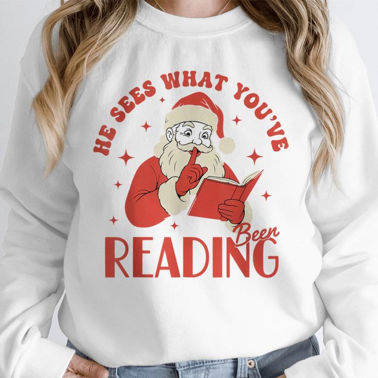 He Sees What You'Ve Been Reading Santa Book Unisex Sweatshirt