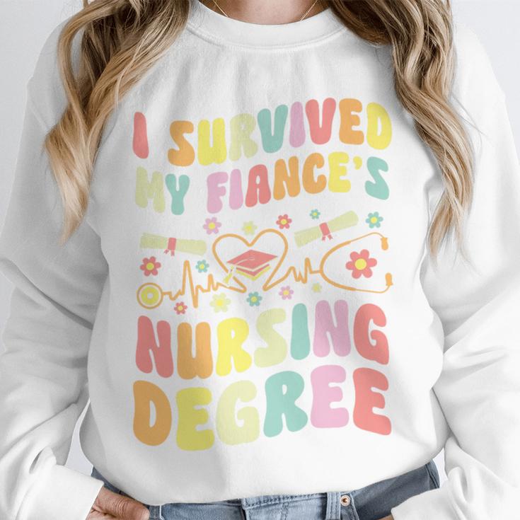 i Survived My Fiance's Nursing Degree Graduation Groovy Premium Unisex Sweatshirt