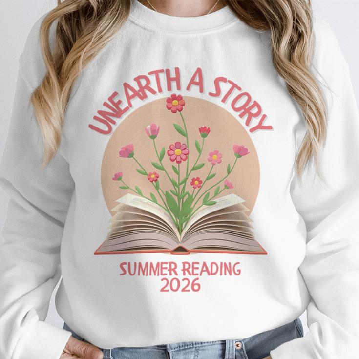Unearth a Story 2026 Summer Reading Program Flowers Book Premium Tri-Blend Unisex Sweatshirt Unearth a Story 2026 Summer Reading Program Flowers Book Premium Tri-Blend Unisex Sweatshirt