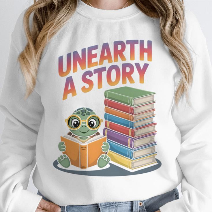 Unearth A Story Cute Turtle Reading Books Librarian Unisex Sweatshirt