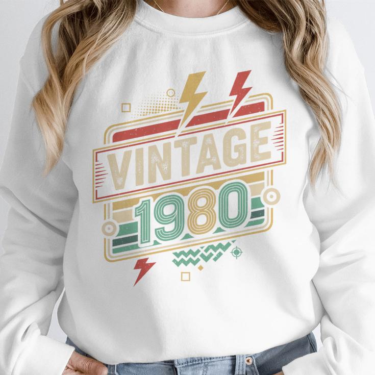 Vintage 1980 Retro Badge Decade Nostalgia Graphic Emblem Premium Tri-Blend Unisex Sweatshirt