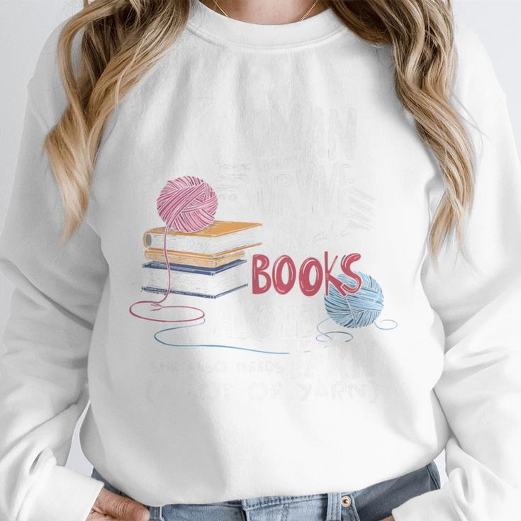 A Woman Cannot Survive On Books Alone She Also Needs Yarn Premium Unisex Sweatshirt