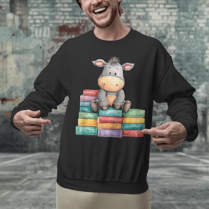 Adorable Donkey With Heart Sitting On Colorful Book Stack Unisex Sweatshirt