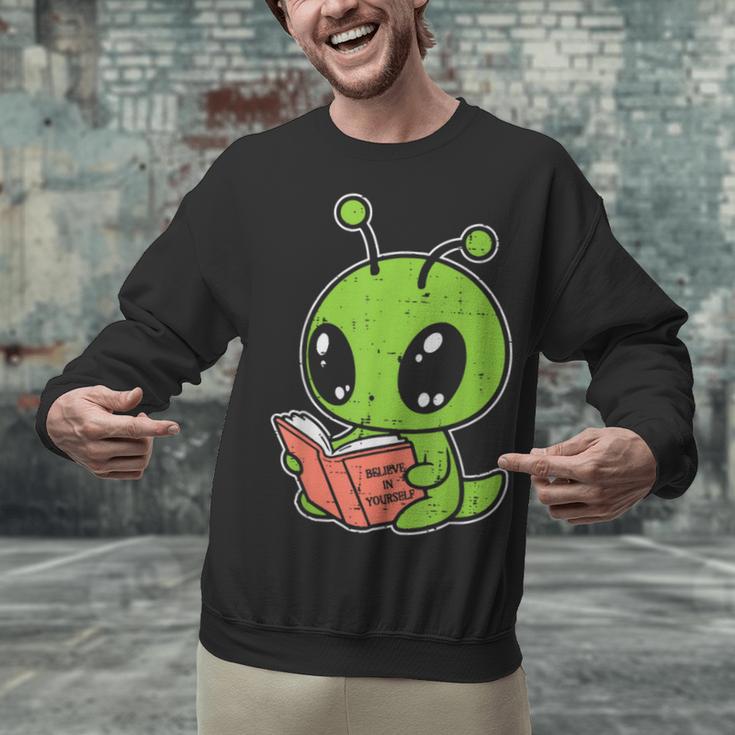Alien Reading Book Believe In Yourself Kids Women Men Unisex Sweatshirt