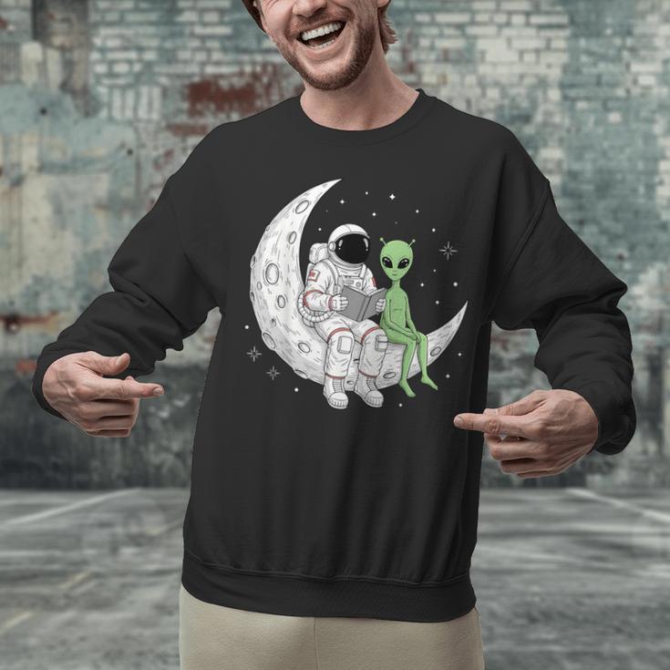 Astronaut Reading Book To Alien Moon Space Book Lover Men Unisex Sweatshirt Astronaut Reading Book To Alien Moon Space Book Lover Men Unisex Sweatshirt