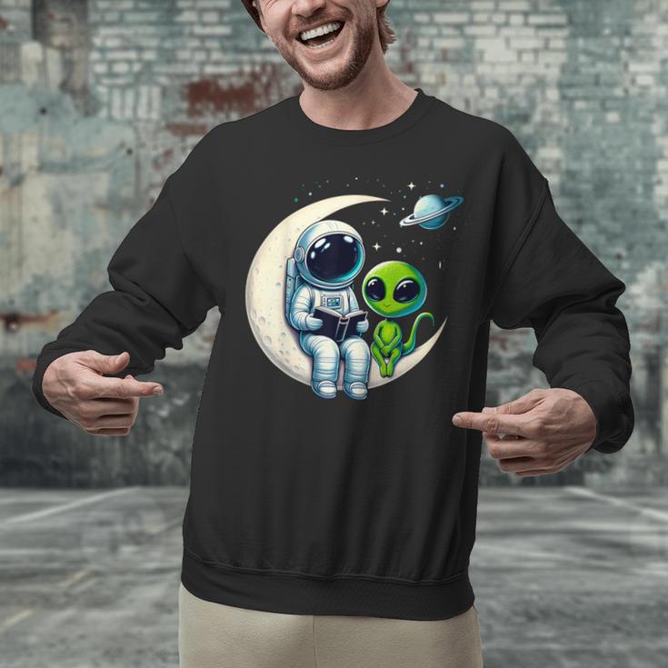 Astronaut Reading Book To Alien Shirt Moon Space Lover Kids Unisex Sweatshirt