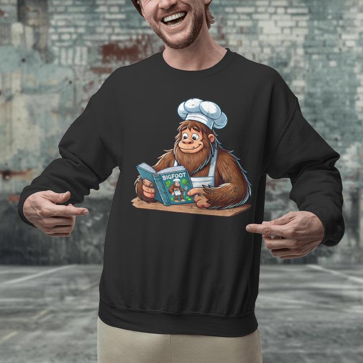 Bigfoot Reading a Cookbook Unisex Sweatshirt