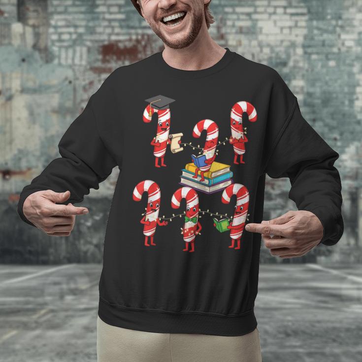 Bookmas Christmas Books Shirt Candy Cane Bookworm Unisex Sweatshirt