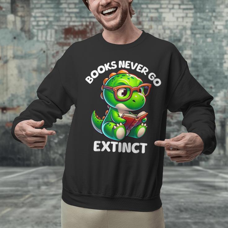 Books Never Go Extinct Reading Dinosaur Bookish Nerdy Unisex Sweatshirt Books Never Go Extinct Reading Dinosaur Bookish Nerdy Unisex Sweatshirt
