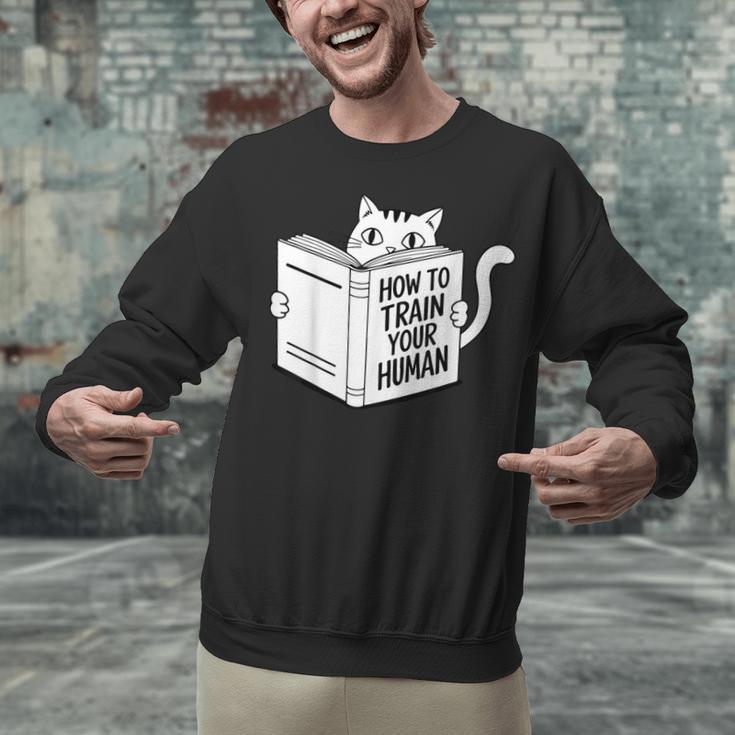 Cat Book Humor How To Train Your Human Unisex Sweatshirt