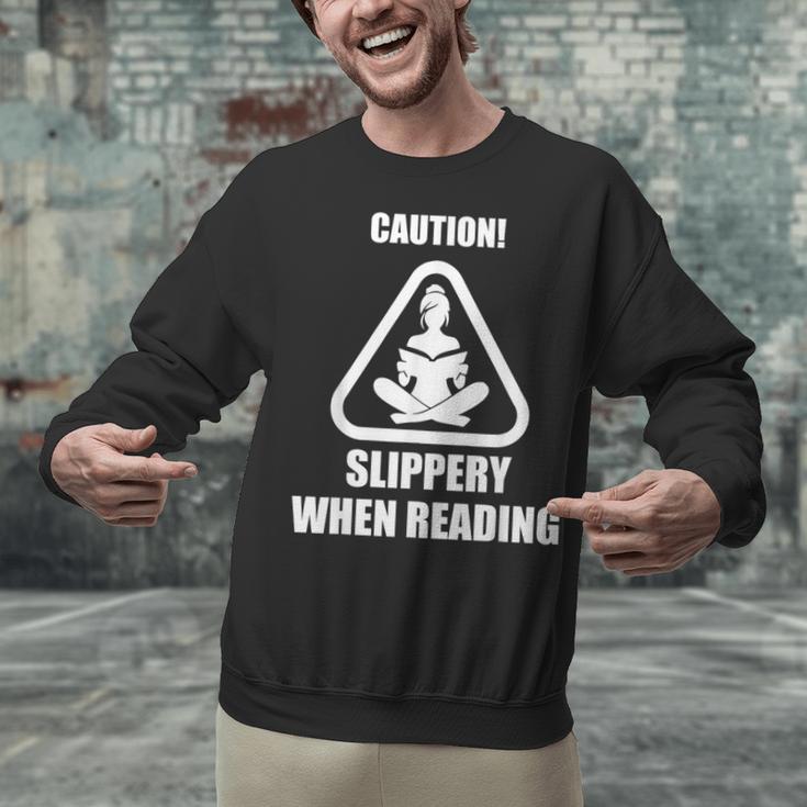 Caution Slippery When Reading Book Lover Unisex Sweatshirt
