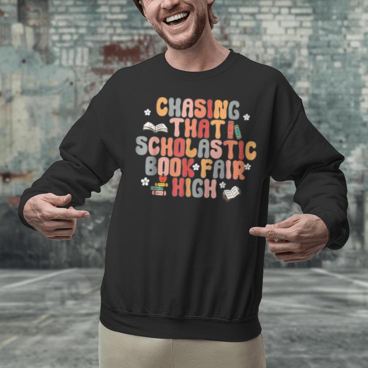 CHASING THAT SCHOLASTIC BOOK FAIR HIGH Unisex Sweatshirt