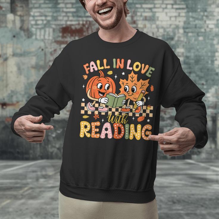 Fall In Love With Reading Autumn Pumpkin Teacher Book Lover Unisex Sweatshirt