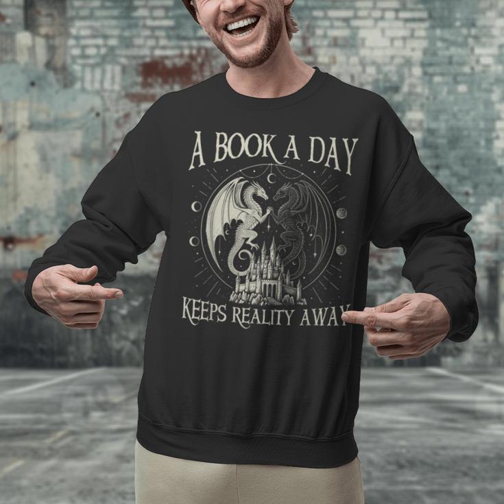 Fantasy Book Club Dragon Reader Book A Day Keep Reality Away Unisex Sweatshirt Fantasy Book Club Dragon Reader Book A Day Keep Reality Away Unisex Sweatshirt