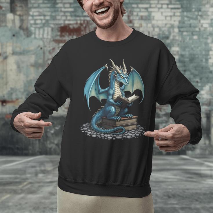 Fantasy Dragon Reading Magical Book Lover Halloween Vibes Unisex Sweatshirt Fantasy Dragon Reading Magical Book Lover Halloween Vibes Unisex Sweatshirt