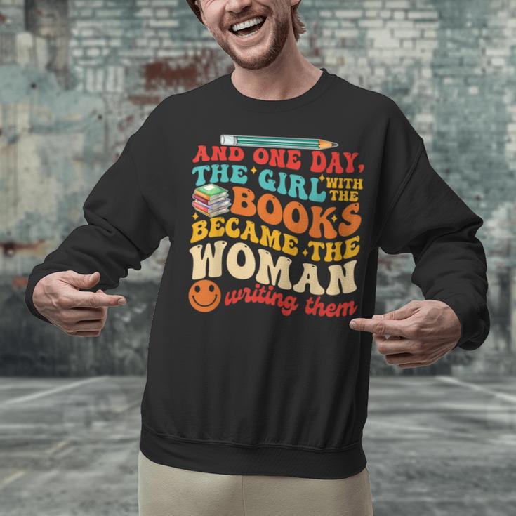 The Girl With The Books Became The Woman Writing Them Unisex Sweatshirt