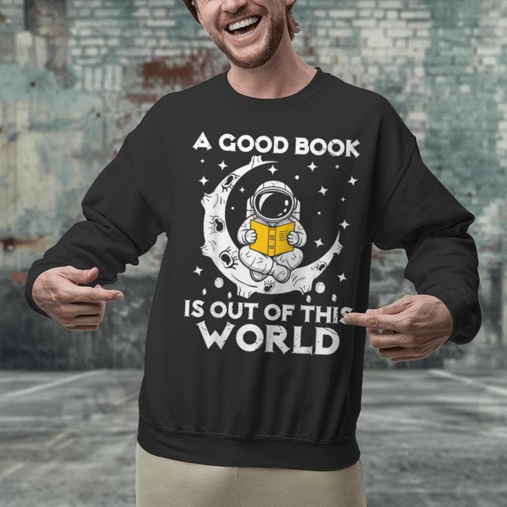 Good Book Is Out Of This World Astronaut Moon Space Reading Unisex Sweatshirt Good Book Is Out Of This World Astronaut Moon Space Reading Unisex Sweatshirt