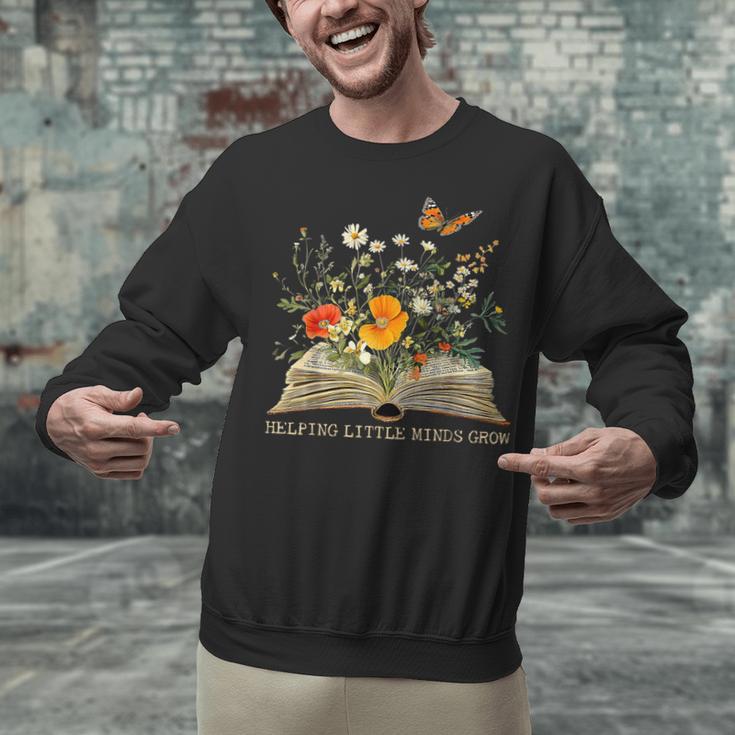 Helping Little Minds Grow Floral Book Education SPED Teacher Unisex Sweatshirt Helping Little Minds Grow Floral Book Education SPED Teacher Unisex Sweatshirt
