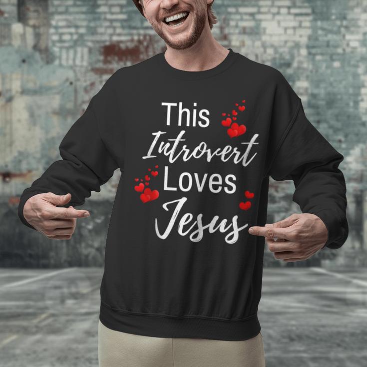 This Introvert Loves Jesus Religious Red Hearts Graphic Unisex Sweatshirt This Introvert Loves Jesus Religious Red Hearts Graphic Unisex Sweatshirt