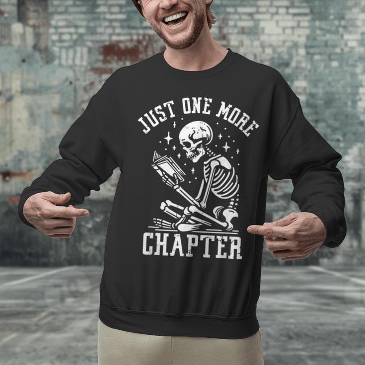 Just One More Chapter Skeleton Reading Book Unisex Sweatshirt Just One More Chapter Skeleton Reading Book Unisex Sweatshirt