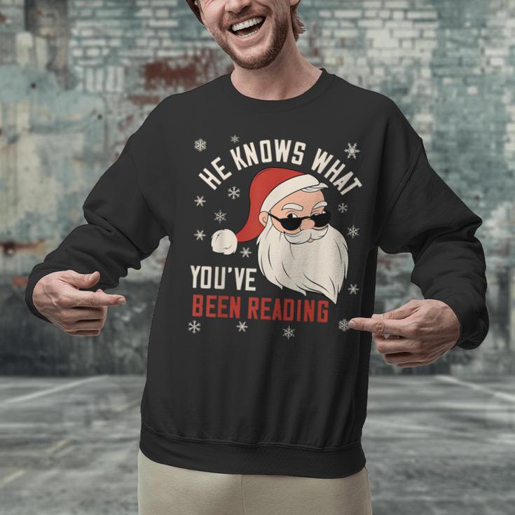 He Knows What You'Ve Been Reading Book Lover Women Santa Unisex Sweatshirt He Knows What You'Ve Been Reading Book Lover Women Santa Unisex Sweatshirt